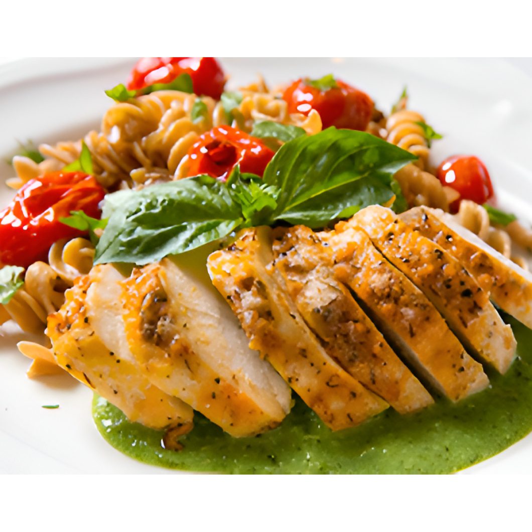 Grilled chicken with pasta and pesto sauce.