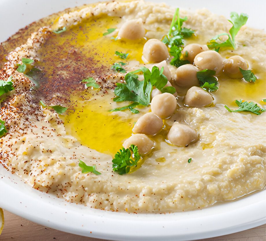 Hummus with olive oil and chickpeas topping.