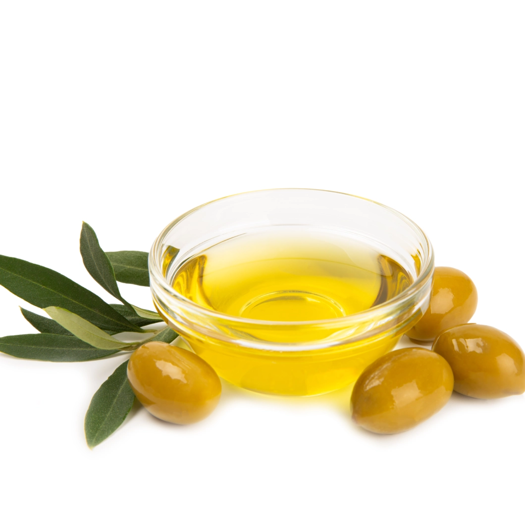 Olive oil in bowl with olives.