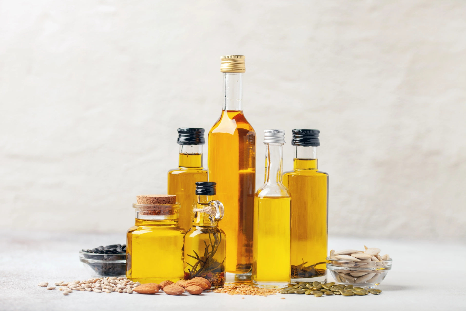 Various bottles of oil and seeds displayed.