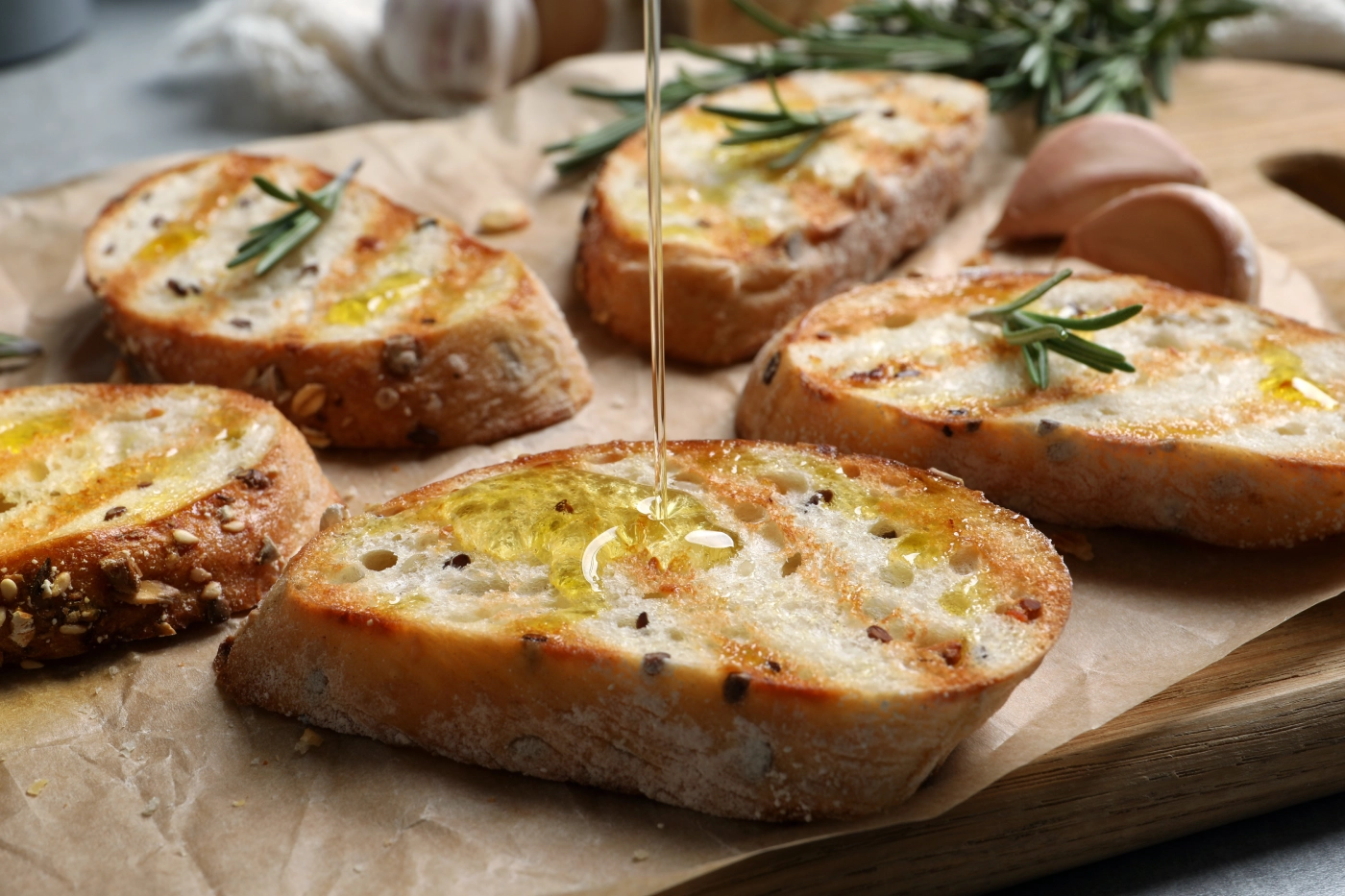 GettyImages-1441676660 Grilled bread with olive oil and rosemary.