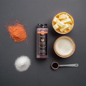 Baking ingredients arranged on a dark surface.