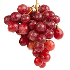 Cluster of fresh red grapes on vine.