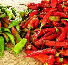 Red and green chili peppers on display.