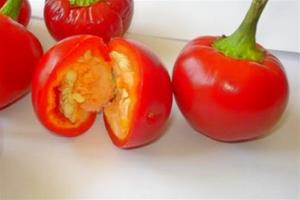 Red cherry peppers, one cut open.