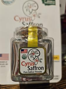 Jar of Cyrus Saffron with packaging.