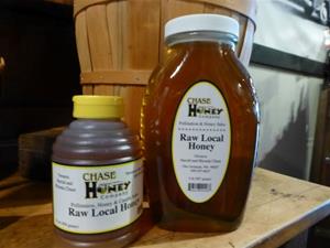Two bottles of Chase Raw Local Honey.