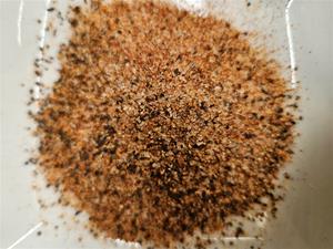 Ground seasoning on a white surface.