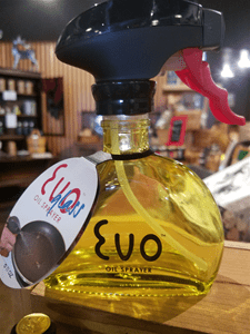 Olive oil spray bottle on display.