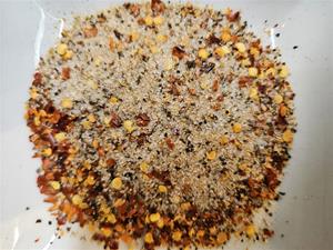 Ground spices with red chili flakes.