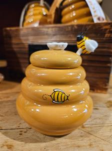 Ceramic honey pot with bee design.
