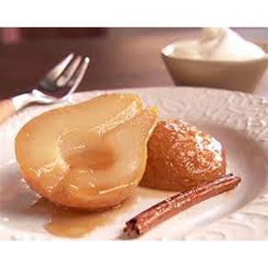 Poached pear with cinnamon stick and cream.