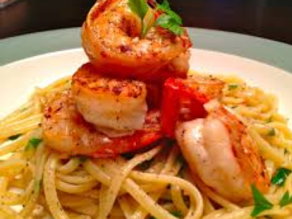 133295164 (2) A plate of shrimp and pasta on top of noodles.