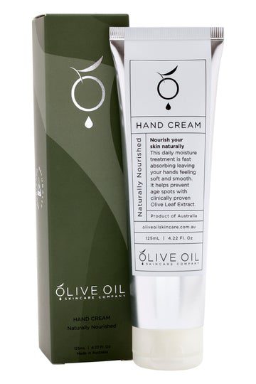 A tube of hand cream sitting next to the box.